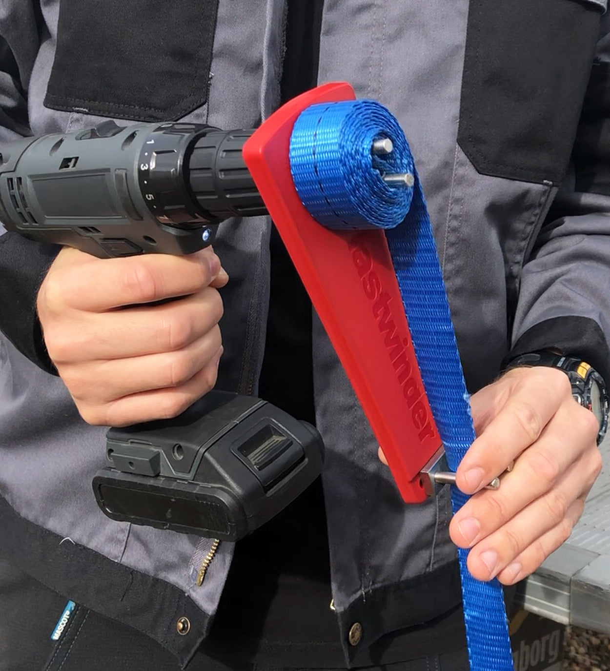 Person holding a Cordless Drill Attachment Fast Strap Winder, designed for seamless strap winding with a drill (not included), featuring advanced dry bearing technology.