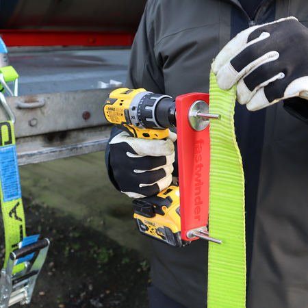Cordless Drill Attachment Fast Strap Winder in use, demonstrating its compatibility with drills for efficient strap winding. Drill not included.